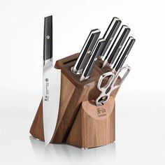 a knife block with several knives in it