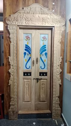 two wooden doors with decorative designs on them