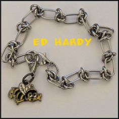 Ed Hardy Bumble Bee Charm Bracelet On Stainless Steel Rope Chain With A Lobster Clasp For Secure Fit. Approximately 8 Inches Long. This Ed Hardy Tattoo Bee Charm Bracelet Is Very Rare And Hard To Find, So Get It While You Still Can! Check Out My Other Ed Hardy Jewelry! Ed Hardy Jewelry, Ed Hardy Eagle, Ed Hardy Accessories, Ed Hardy Set, Ed Hardy Tattoos, Ed Hardy Phone Case, Ed Hardy Tank Top, Butterfly Charm Bracelet, Y2k Jewelry