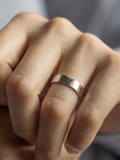 Our Still Waters Band is a striking way to honor an enduring love. This timeless piece is crafted from 14k solid gold, making it durable and long-lasting. The flat design gives it a sleek, modern look, making it the perfect choice for those who want a traditional wedding band with a contemporary twist. The ring is available in a variety of widths and can be engraved for a personalized touch. Traditional Wedding Bands, 14k Gold Wedding Band, 14k Gold Ring, Jewelry Cleaner, Exquisite Jewelry, Timeless Pieces, Timeless Beauty, Jewelry Care, Solid Gold