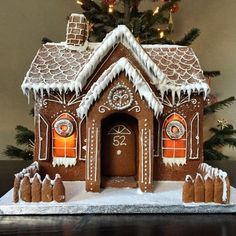 a gingerbread house decorated with icing and decorations