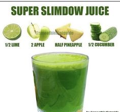 a glass filled with green juice next to sliced cucumbers