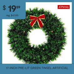 a christmas wreath with a red bow on it and the words, $ 19 99 reg $