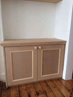 a cabinet with two doors on top of it