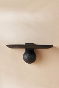 a black object is hanging on the wall