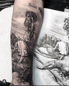 a man with a tattoo on his arm next to an open book and a drawing