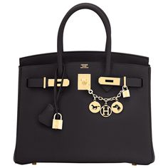 Chicjoy is pleased to present this Hermes Birkin 30cm Black Togo Gold Hardware Bag Brand New in Box. Store Fresh. Pristine Condition (with plastic on hardware) Perfect gift! Comes with lock, keys, clochette, sleeper, raincoat, and orange Hermes box. Make a statement without saying a word! This is the ultimate lifetime Birkin for the chic and elegant fashionista! Black Togo with lush gold hardware is a very sophisticated and sought-after combination. The Black Birkin has seen on so many celebs an Birken Bag, Bethenny Frankel, Luxury Bags Collection, Box Store, Girly Bags, Kelly Bag, Vintage Hermes, Chic And Elegant, Luxury Purses