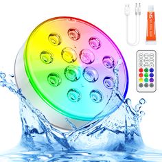 an image of a colorful speaker with water splashing around it and the sound board next to it