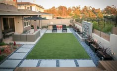 the backyard is clean and ready to be used as an outdoor living space for entertaining