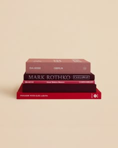 three books stacked on top of each other in front of a beige background with the title mark rotnick