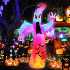 a yard decorated with halloween decorations and lights