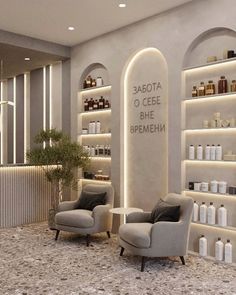 the interior of a salon with two chairs and shelves filled with personal care products on display