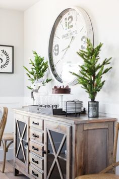 a clock mounted to the side of a wooden table