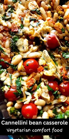 a close up of a plate of food with tomatoes, beans and spinach on it