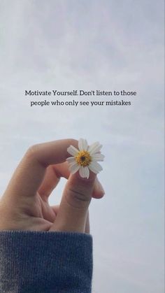 someone holding a flower in their hand with the quote motive yourself don't listen to those people who only see your matakes