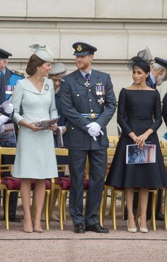 the duke and princess of cambridge are standing in front of some people at an event