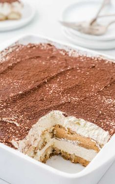 a cake in a white pan on a table