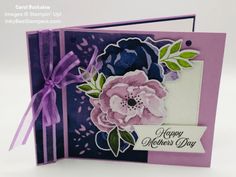 a close up of a greeting card with flowers and ribbon on the front, which reads happy mother's day