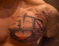 a man's chest with an oil pump tattoo on his left arm and shoulder