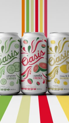 three cans of soda are lined up against a multi - colored striped background with the word brasil on it