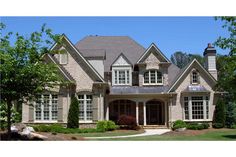 a large brick house with lots of windows