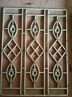 decorative iron work on the side of a wall in an old style home or office