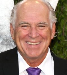 an older man wearing a suit and tie