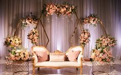 a couch and some chairs with flowers on them