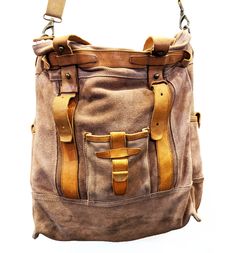 Leather Satchel With Pockets For On-the-go, On-the-go Travel Backpack With Pockets, Luxury Backpack For Trips, Brown On-the-go Shoulder Bag With Pockets, Luxury Shoulder Bag With Leather Handles In Backpack Style, Vintage Everyday Shoulder Bag With Pockets, Vintage Large Capacity Standard Backpack, Brown Satchel Travel Bag For Everyday Use, Brown Canvas Hobo Bag With Pockets