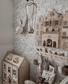 there is a doll house on the wall