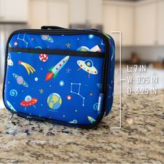 100% play-proof and perfect for elementary school age, Wildkin's classic square shaped lunch box is designed to help you and the environment by offering a fun and reusable option for lunch and snack time. Apart from the roomy main compartment, this lunch box features a zippered front pocket that is perfect for hiding a surprise treat or securing sweet notes. The lunch box also features an interior mesh pocket for storing napkins, utensils or an ice pack. Sized just right for kids and adults, the Portable Lunch Box For Travel And Back To School, Multicolor Rectangular Lunch Bag For Playtime, Functional Multicolor Lunch Box For School, Functional Multicolor School Lunch Box, Portable Rectangular Lunch Bag For Back To School, Rectangular Portable Lunch Bag For Back To School, Functional Rectangular Lunch Bag For Back To School, Multicolor Rectangular Lunch Box For Playtime, Multicolor Rectangular Lunch Bag