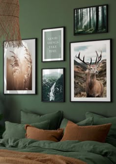 a bedroom with green walls and pictures on the wall