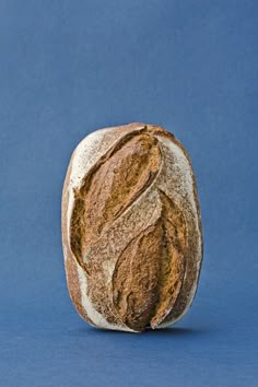 a loaf of bread sitting on top of a blue surface