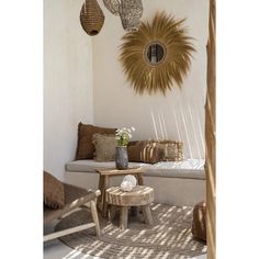 a living room filled with furniture next to a wall mounted sunflowers on the wall