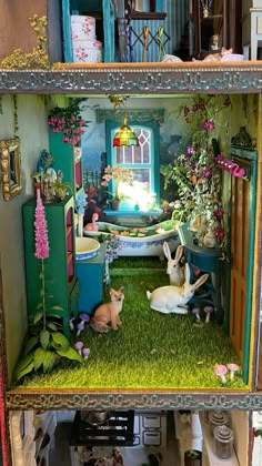 a doll house with two rabbits in it