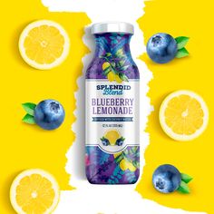 a bottle of blueberry lemonade next to sliced lemons on a yellow background