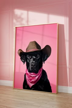 a black dog wearing a cowboy hat and pink bandanna sitting in front of a pink wall