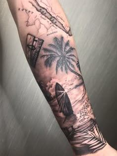 a man's arm with a palm tree and an airplane on the beach tattoo