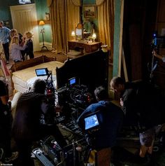 a group of people in a room with cameras