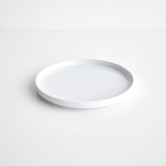 a white plate sitting on top of a table