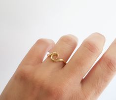 "Fashion and girly, part of our \"Minimal Rings\", this stunning gold ring designed for sea and ocean lovers. Use as a standalone piece or with stacking rings. Item Details ❤ Made to Order ✔ Available Gold Color: Rose Gold, Yellow Gold, White Gold ✔ Width: 7.8mm ✔ Thickness: 1.45mm ✔ Band details: Width: 1.50mm Thickness: 1.45mm ✔ Gold weight approx: 2.0 grams (The gold weight is for 14K gold, ring size 7 ) ★ ★ ★ FREE WORLDWIDE SHIPPING BY DHL EXPRESS ★ ★ ★ ✔ HANDMADE We use only high-quality ma Minimal Rings, Ocean Ring, Gold Wave Ring, Micro Pave Ring, Gold Pinky Ring, December Birthstone Ring, Blue Topaz Engagement Ring, Minimal Ring, Gold Waves