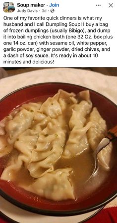 a red bowl filled with dumplings on top of a table