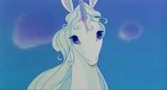 a white unicorn with blue eyes and long hair