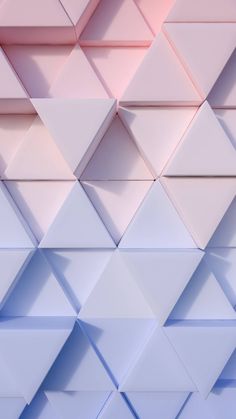 an abstract background consisting of white and blue triangles with pink highlights on the top right corner