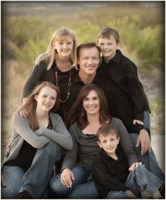 a family is posing for a photo together