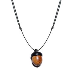 PRICES MAY VARY. Acorn Necklace Pendant: This acorn pendant necklace is exquisitely crafted from a delicate little acorn on an adjustable leather cord. A fully handmade hollow acorn with a swivel lid design allows you to put small meaningful objects inside and seal them well! Natural Oak Wood Acorn Necklace: This acorn pendant is made of rare ebony wood, which is fine, and dense, with small and rare brown eyes, hardness, glossy surface, and no special odor. It's Decorative and Practical: The aco Meaningful Objects, Fall Necklace, Acorn Pendant, Acorn Necklace, Autumn Necklace, Box Necklace, Ebony Wood, Necklace Box, Fall Jewelry