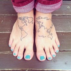 a woman's feet with tattoos on them and the world map tattooed on her left foot