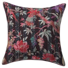 a black and pink floral pillow with red flowers on the front, sitting on a white background