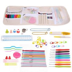 an assortment of crafting supplies including scissors, markers and pins on a white background