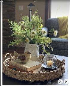 a tray with flowers and books on it